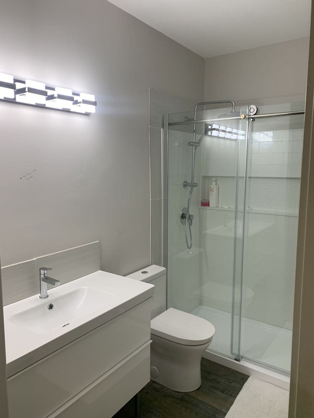 Finished bathroom with glass shower